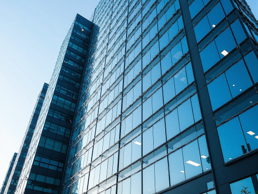 现代化办公大楼外景，玻璃幕墙建筑，公司标识清晰可见